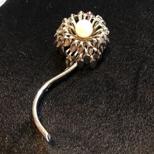 Vintage silver brooch with pearl center.